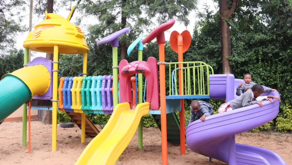 Colourful playground equipment at Faulu School